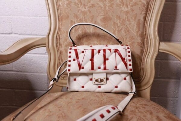 A white bag with red lettering on it.
