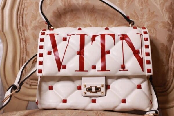 A white bag with red lettering on it.