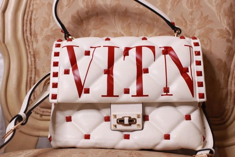 A white bag with red lettering on it.