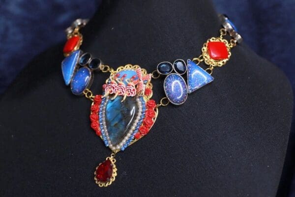 A necklace with many different colored stones on it.