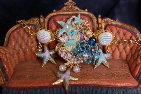 A close up of some jewelry on top of a chair