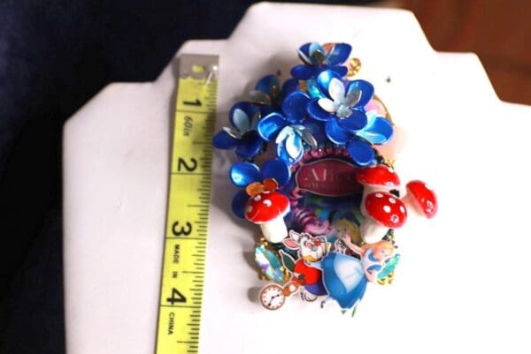 A measuring tape and some little plastic toys