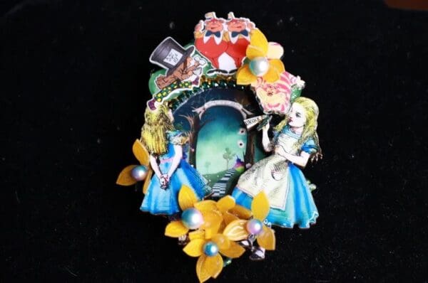 A picture of the alice in wonderland pin.