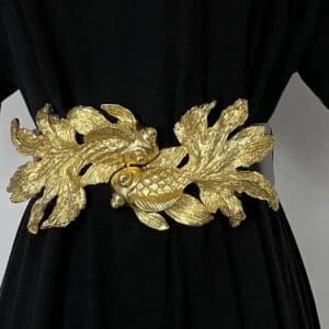 A gold belt with leaves on it