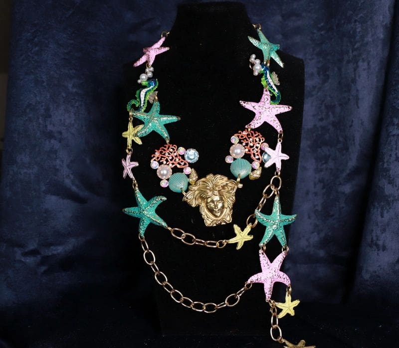 A necklace with stars and chains on it