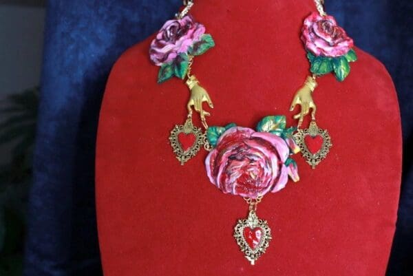 A red velvet display with a necklace and earrings.