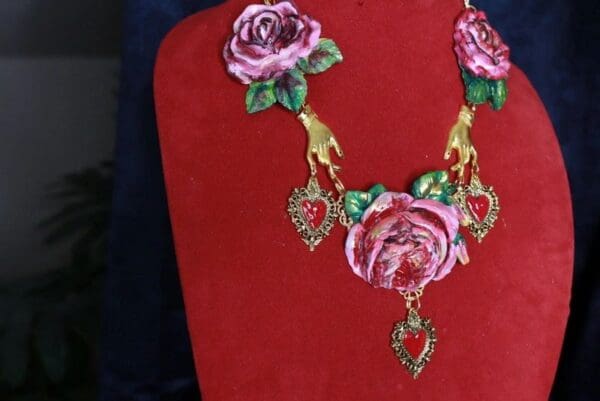 A red display with a necklace and earrings on it