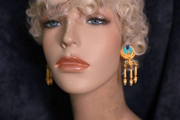 A mannequin with blonde hair and blue eyes.