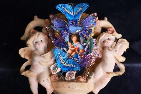 A statue of a woman surrounded by butterflies.
