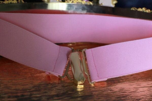 A close up of the bottom of a pink box