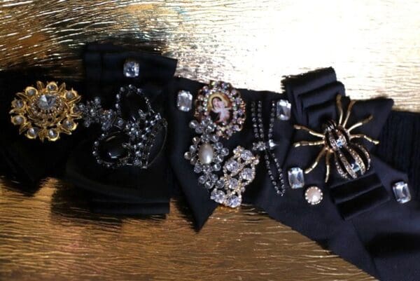 A close up of some black jewelry on top of a table.