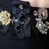 A close up of some black and gold jewelry
