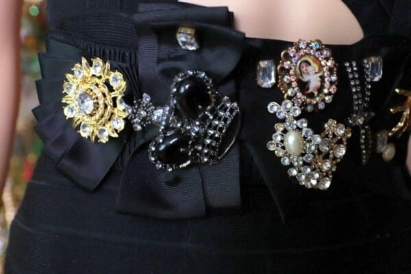 A close up of some black and gold jewelry