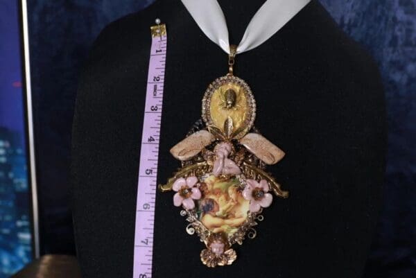 A woman wearing a necklace with a clock on it
