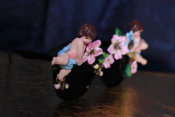 A couple of figurines sitting on top of a table.