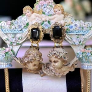 A pair of earrings on top of a chair.