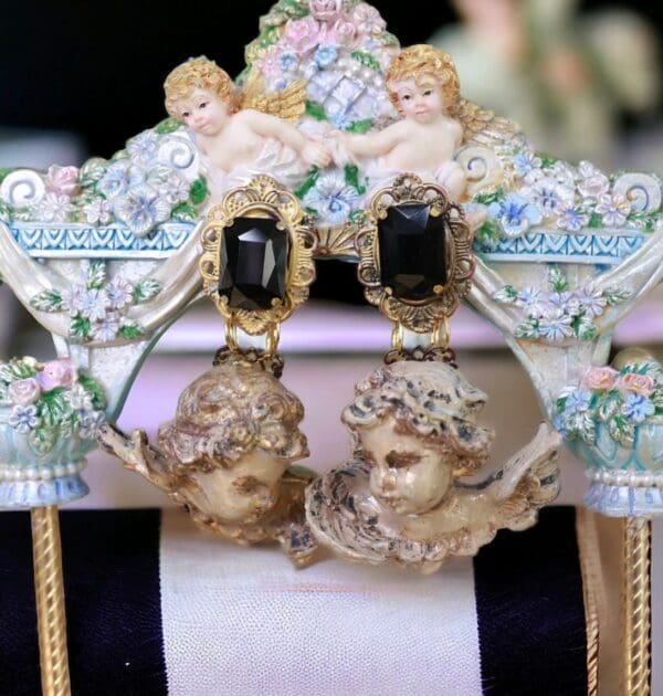 A pair of earrings on top of a chair.