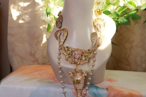 A vase with some jewelry on it
