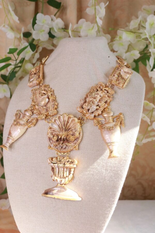 A necklace is displayed on the table.