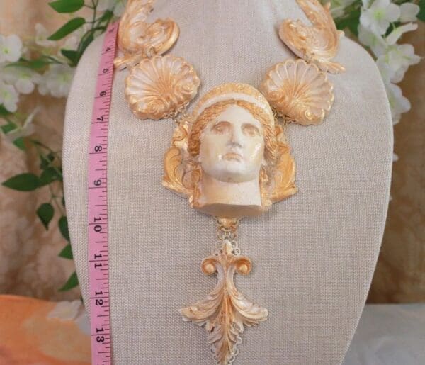 A statue of a woman with a crown on it