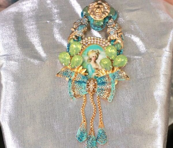 A close up of a necklace with many different colored beads
