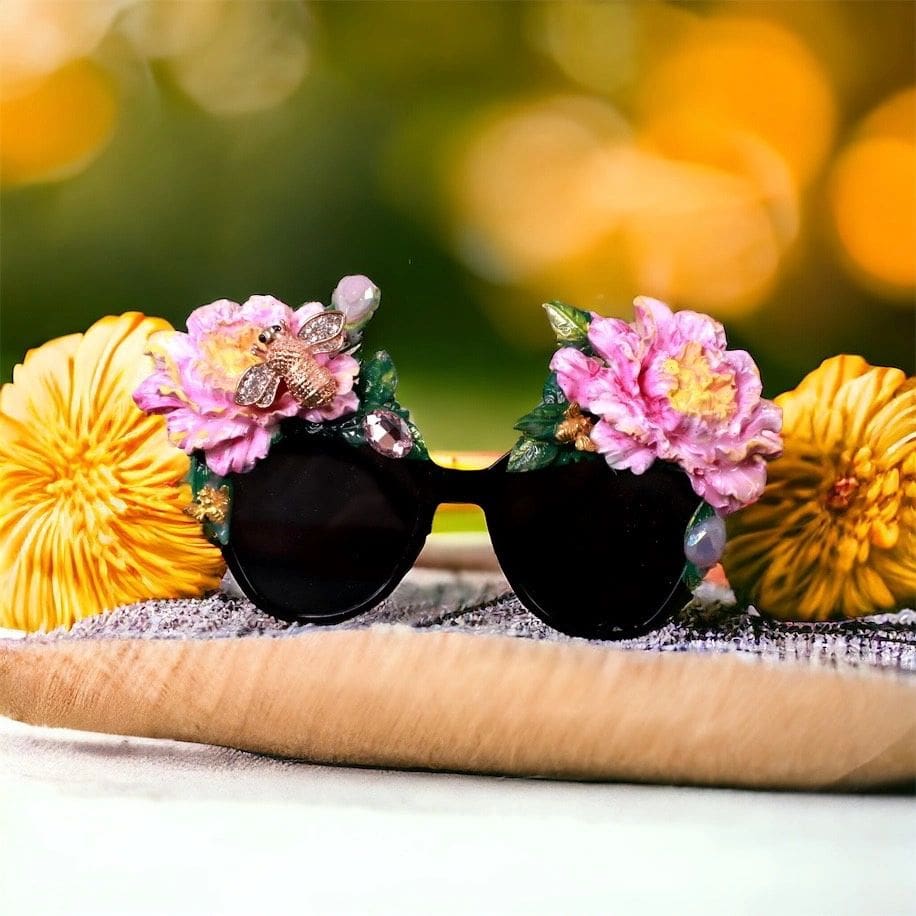 A pair of sunglasses with flowers on them.