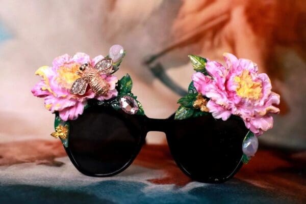 A pair of sunglasses with flowers on them.