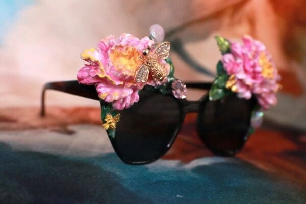 A pair of sunglasses with flowers on them.