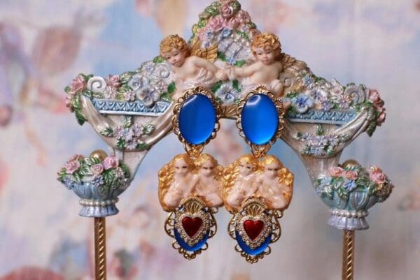 A pair of earrings hanging on top of a statue.