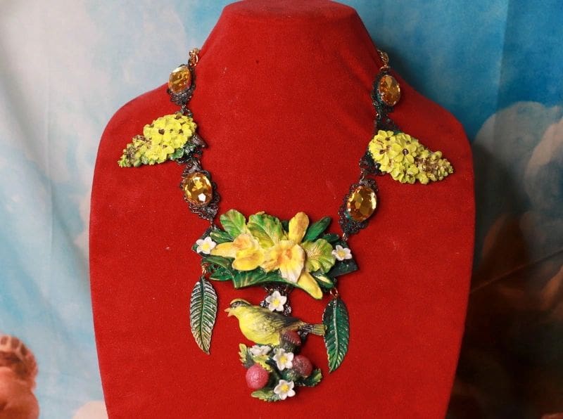 A red display stand with a necklace on it