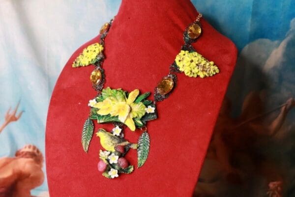 A red necklace with yellow flowers on it