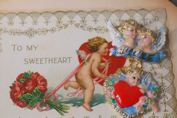 A vintage valentine card with cherubs and roses.