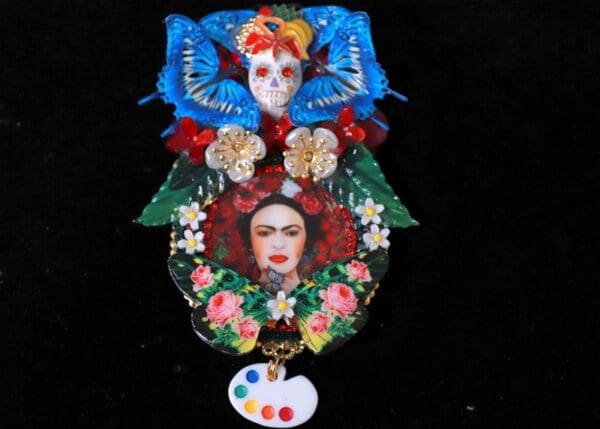 A painting of frida kahlo and butterflies on the back.