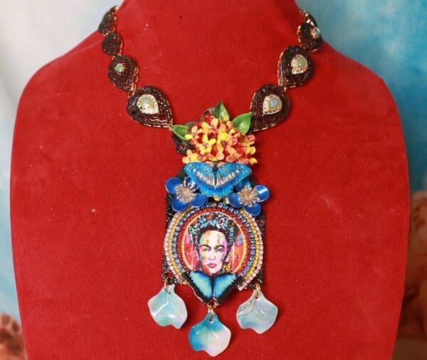 A necklace with a woman 's face on it.