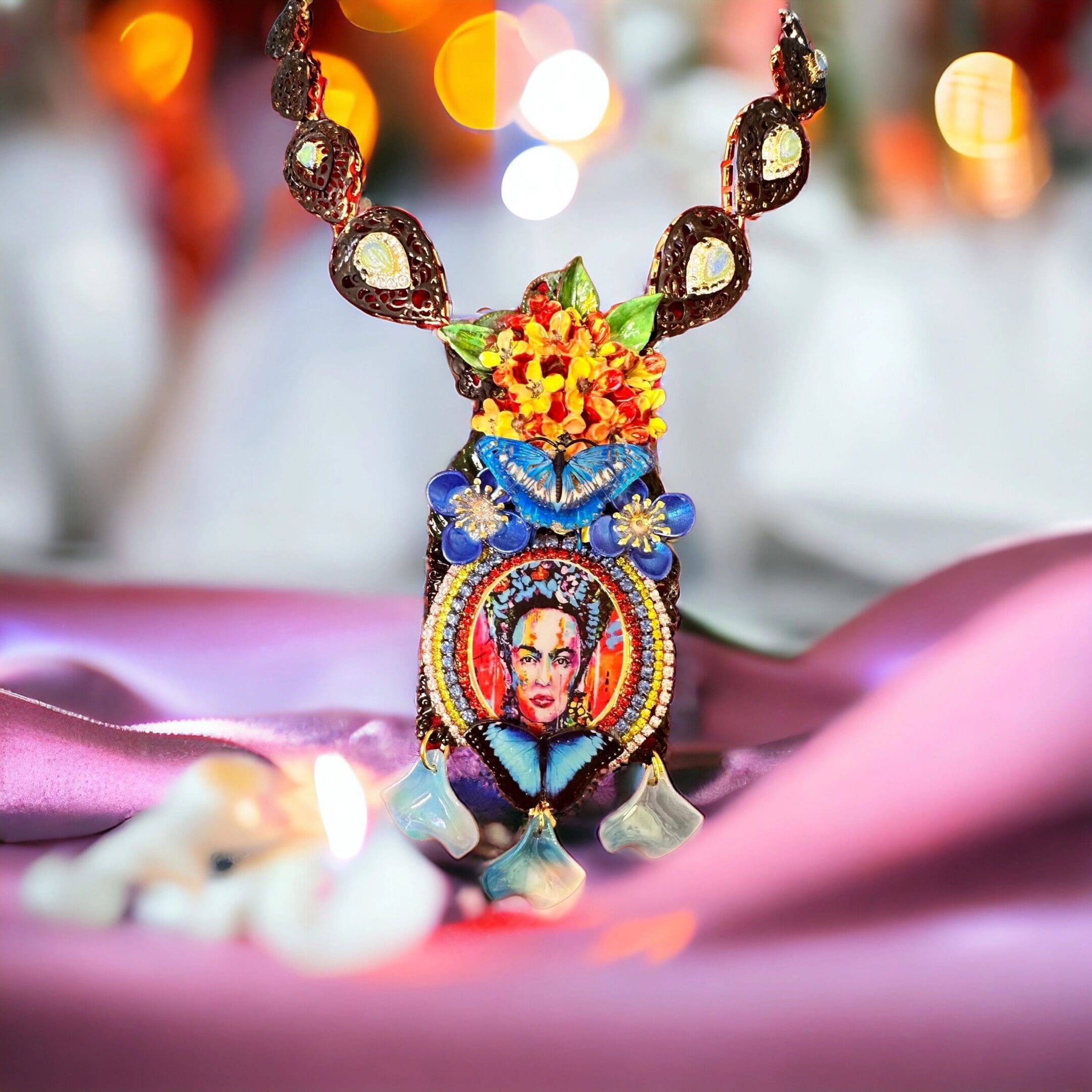 A necklace with a picture of frida kahlo on it.