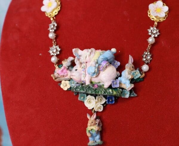 A necklace with flowers and animals on it