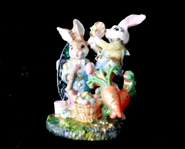 A group of bunnies and eggs on display.