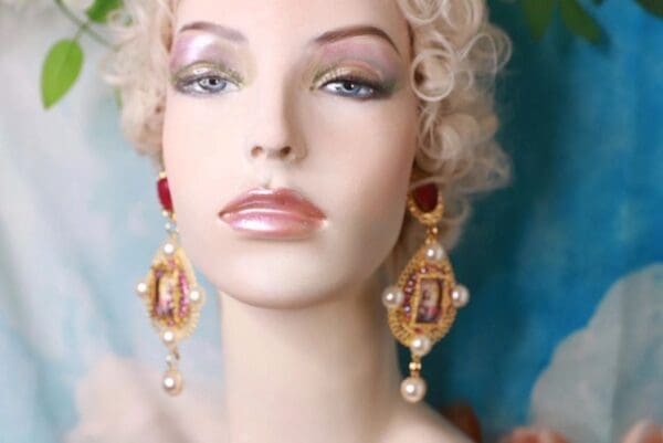 A mannequin with long earrings and curly blonde hair.