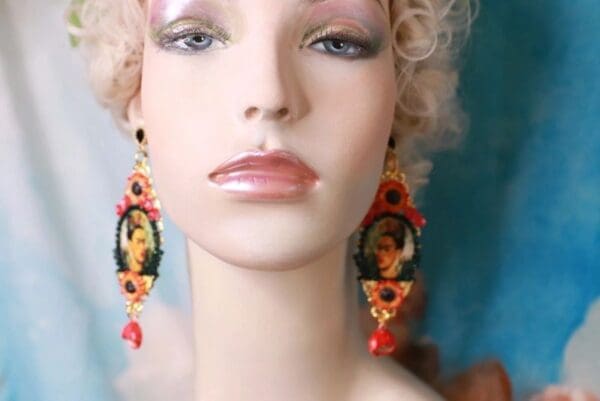 A mannequin wearing earrings with an image of a woman.