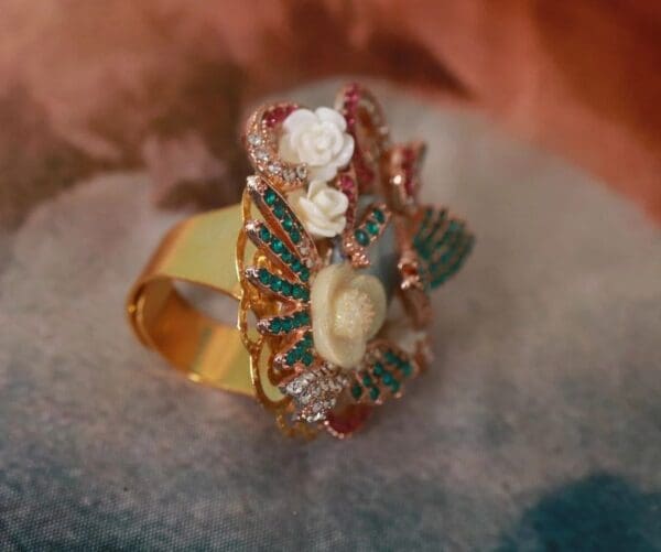 A gold ring with some flowers on it