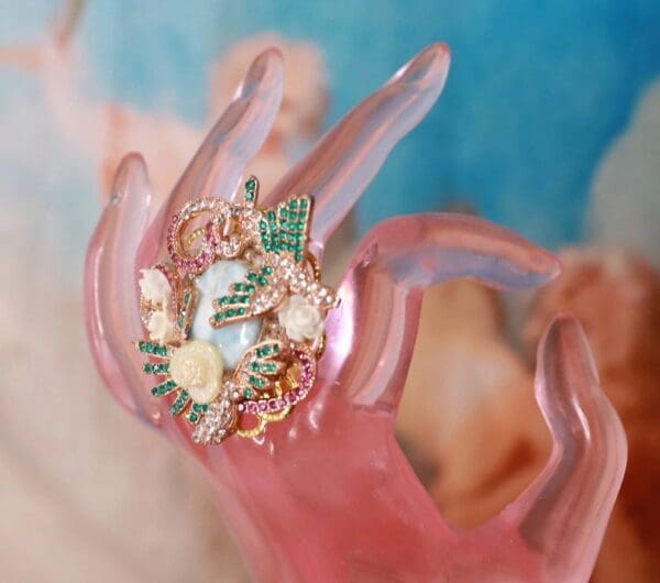 A hand with some kind of jewelry on it