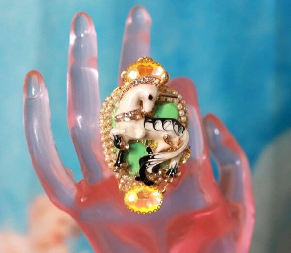 A hand with a ring on it's finger