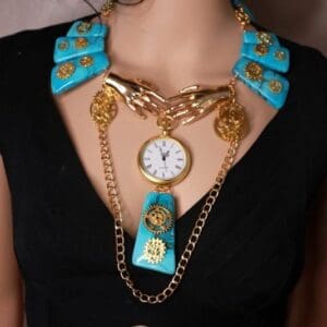 A woman wearing a necklace with chains and a clock.