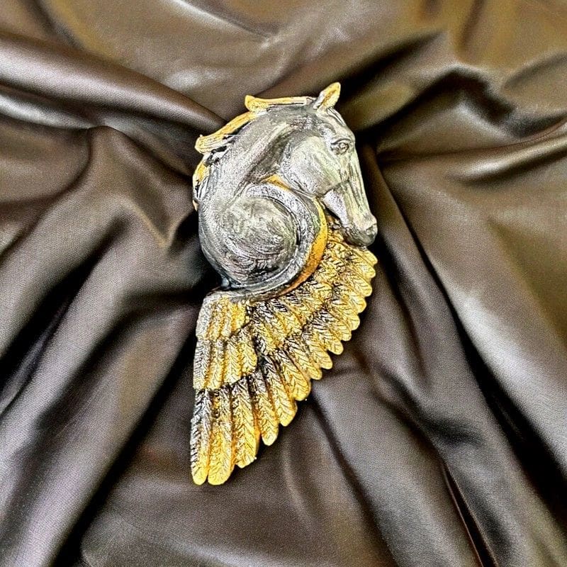 A bird with wings spread on top of a brown cloth.