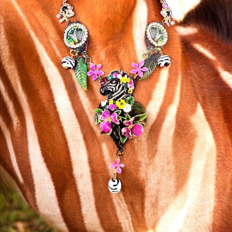 A close up of the necklace on a zebra