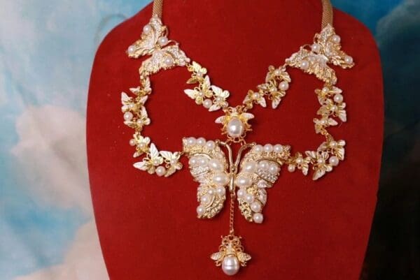 A necklace with a butterfly on it