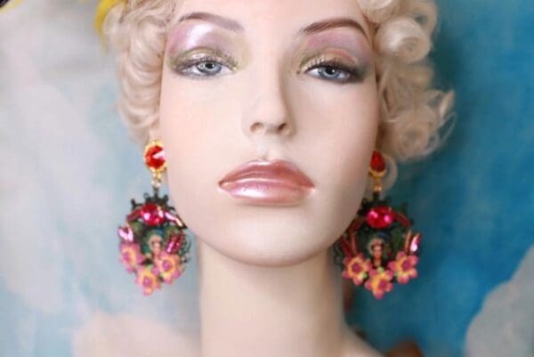 A mannequin with earrings and a blonde wig.