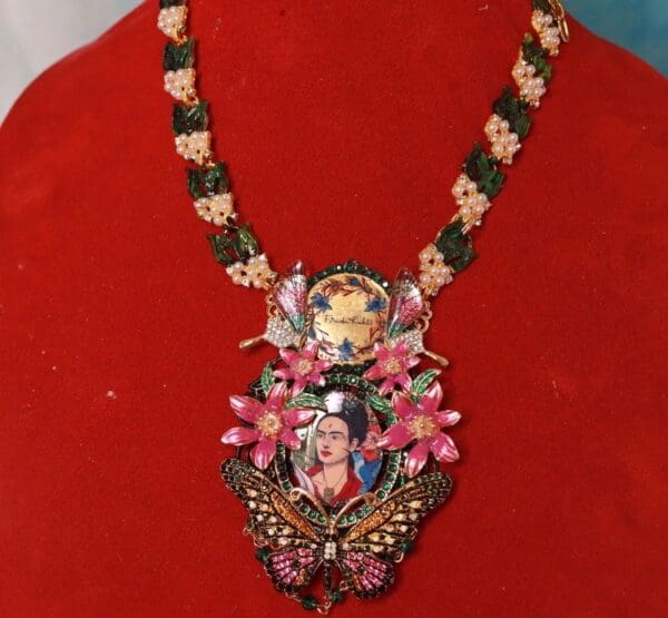 A necklace with a woman 's face on it.