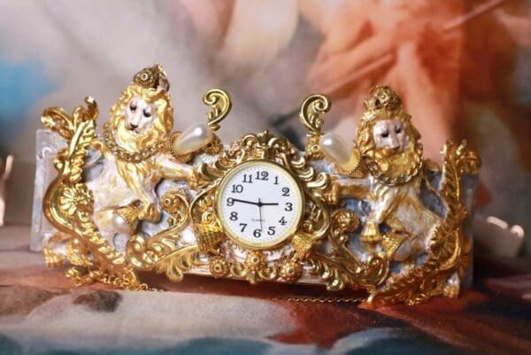 A gold crown with a clock on it.