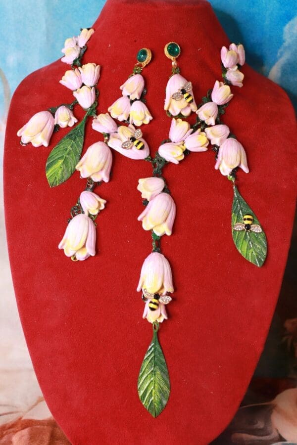 A red heart with flowers and leaves on it.